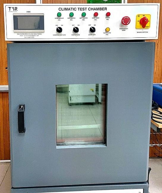 A grey box with buttons and a glass window
AI-generated content may be incorrect.